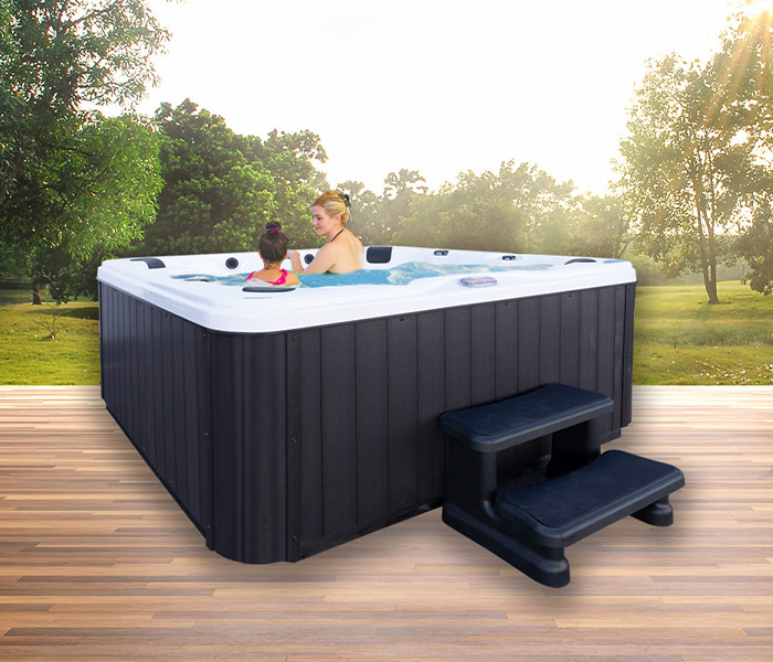 Hot Tubs, Spas, Portable Spas, for sale American Spas American Spas hot tub being used in a family setting